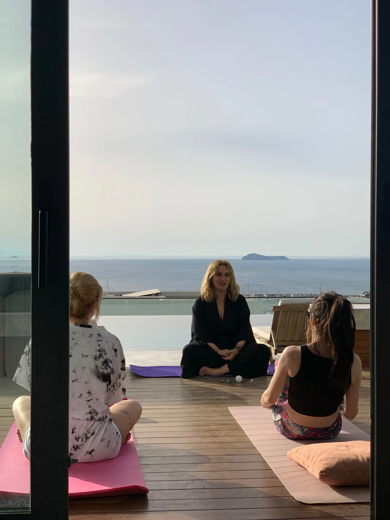 Sunset meditation session overlooking the Bodrum marina at Trovilla